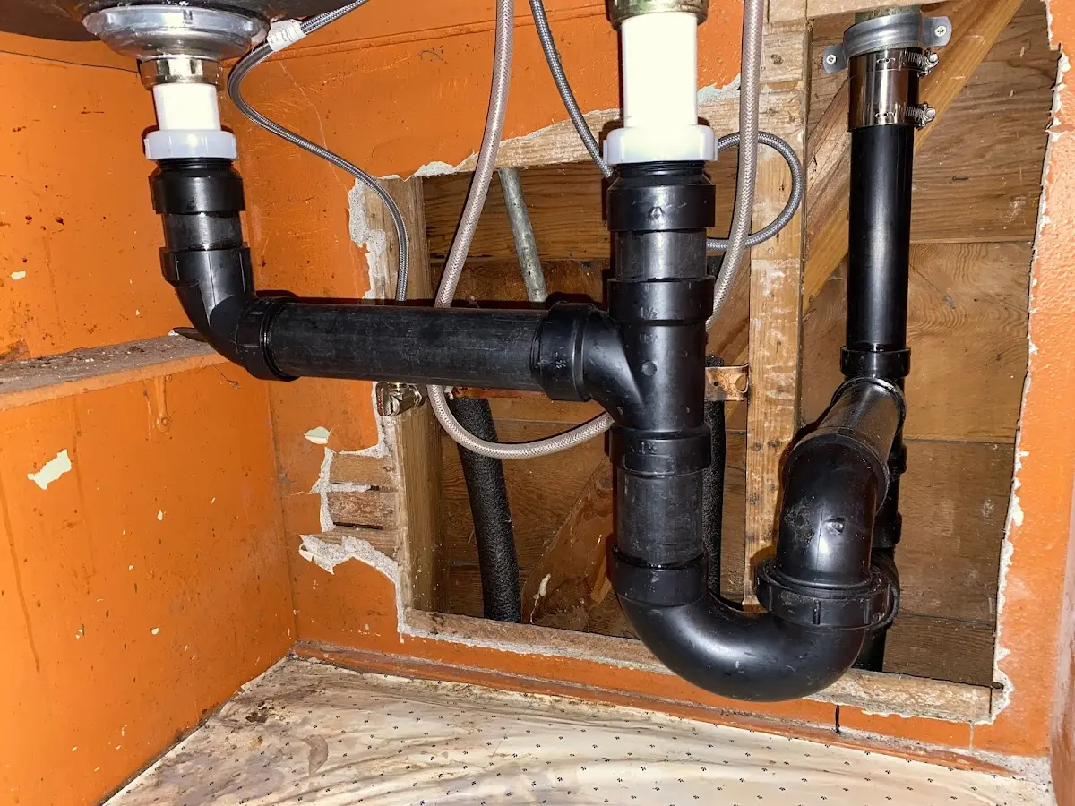 Professional Garbage Disposal Repair equipment and tools on the job in Hunter